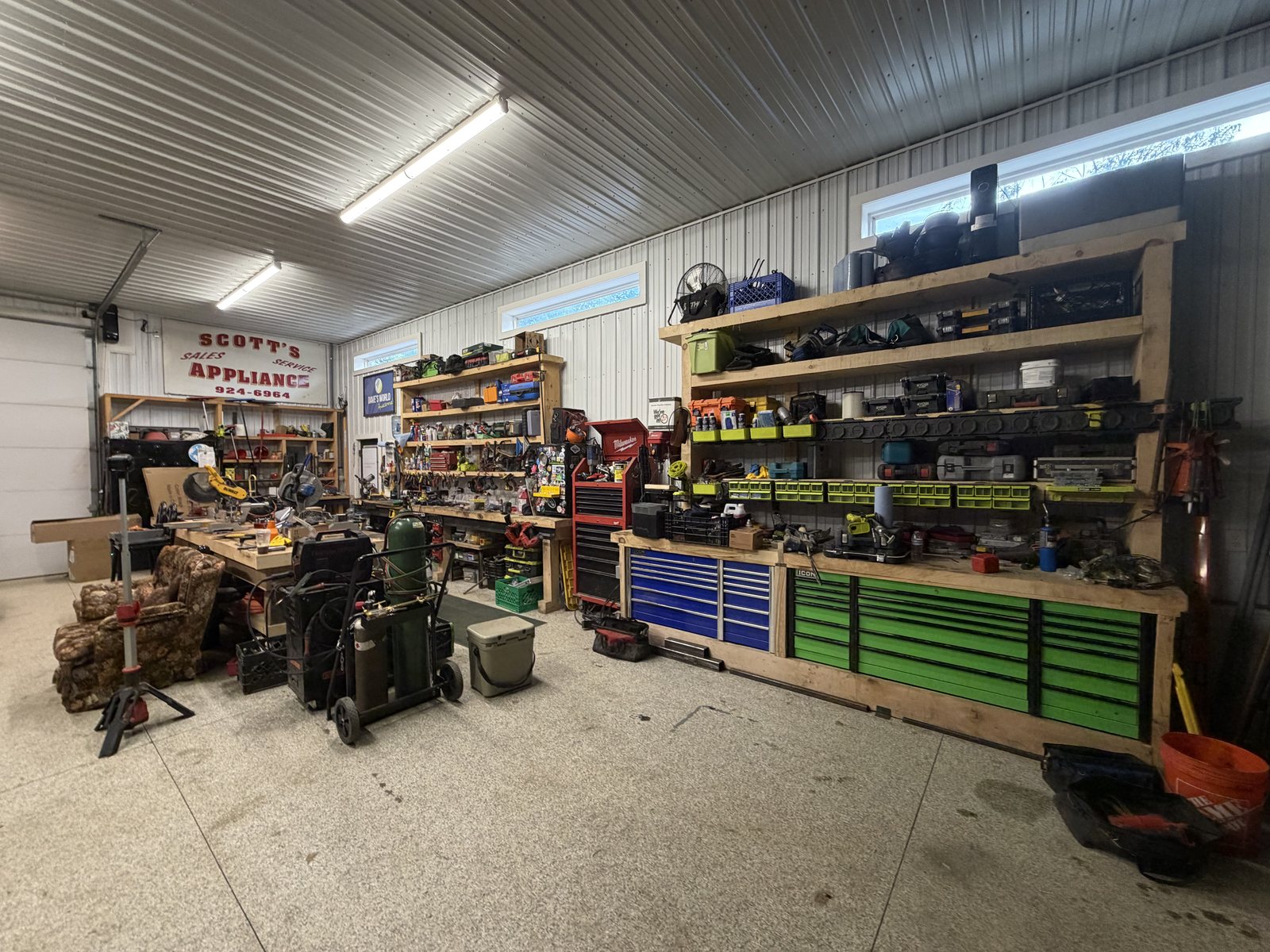 The welding bay and carpentry bench in the Homestead Heroes shop